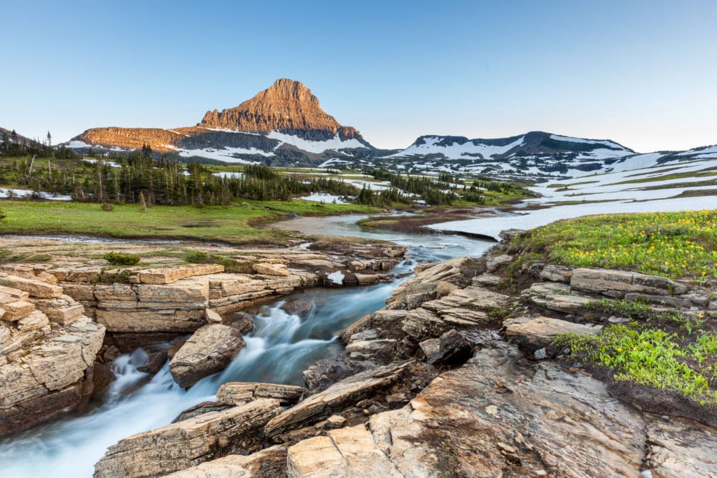Glacier Naitonal park wtih a stream from Tumbleweed Travel