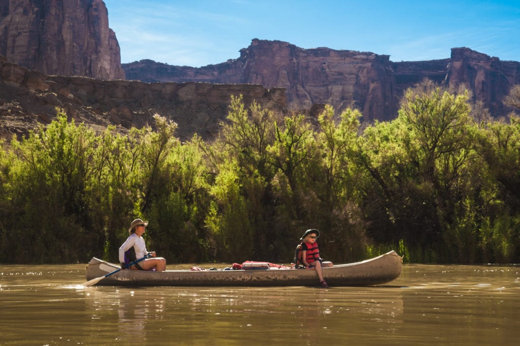 Mother and daughter paddling a canoe on Green River, Utah Mother and daughter paddling a canoe on Green River Utah from Tumbleweed Travel