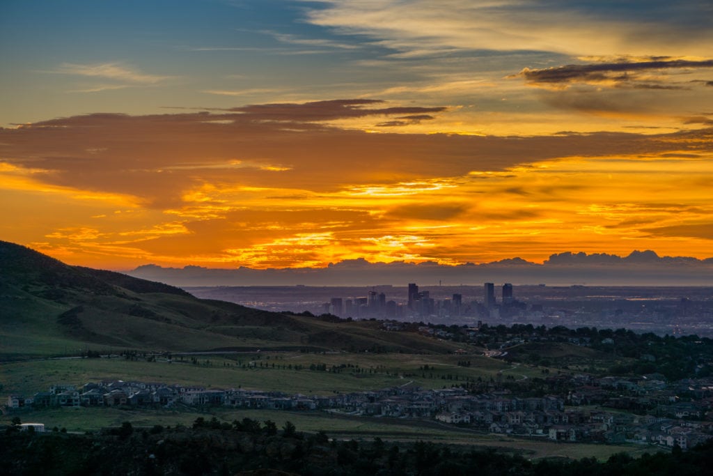 A stunning sunrise over Denver as seen from Red Rocks Amphitheatre in Morrison Colorado. from Tumbleweed Travel
