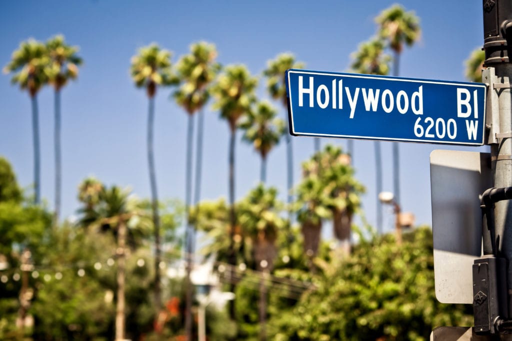 Hollywood boulevard sign, with palm trees in the background Hollywood boulevard sign with palm trees in the background from Tumbleweed Travel
