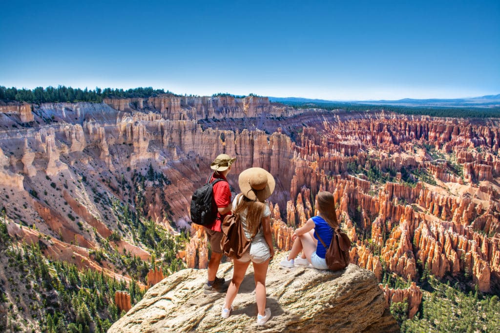 People on hiking trip. Family on top of mountain enjoying time together looking at beautiful view. Inspiration Point Bryce Canyon National Park Utah USA 1 from Tumbleweed Travel