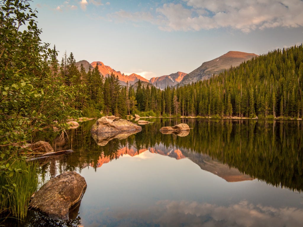 Sunset reflection of mountains and rocks at Bear Lake in Rocky Mountain National Park Colorado 1 from Tumbleweed Travel