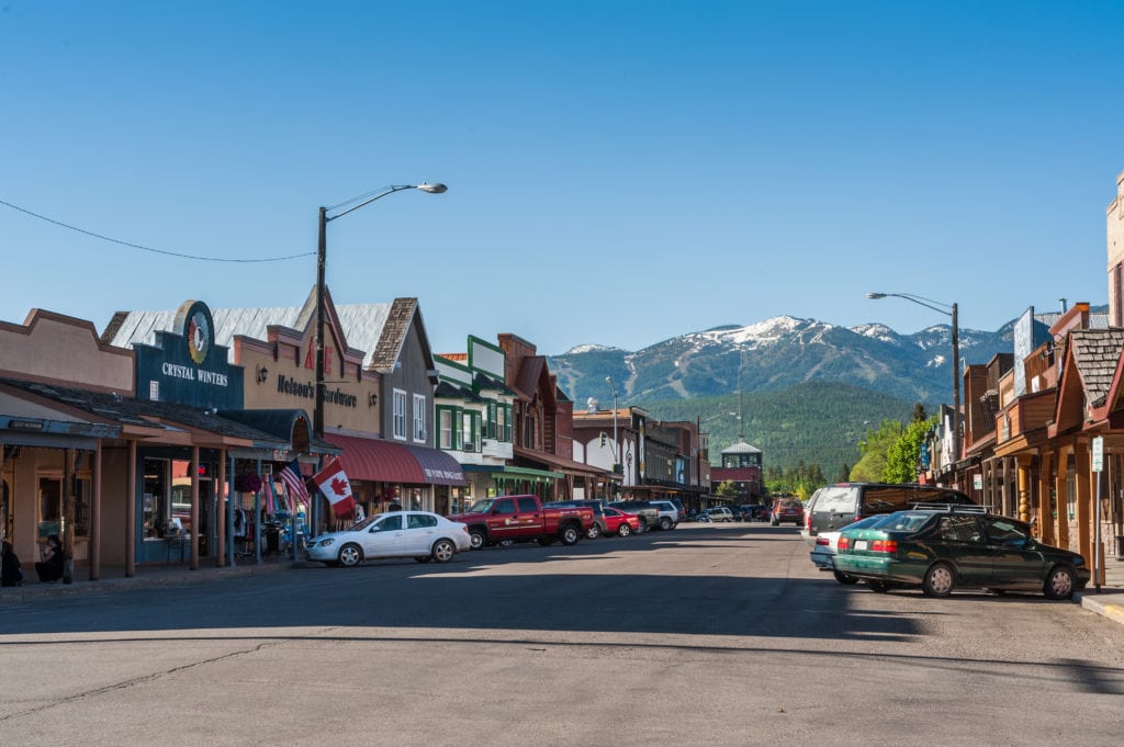 view of the main street of Whitefish city with houses stores cars from Tumbleweed Travel