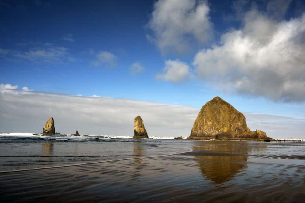 This is Haystack Rock at Cannon Beach, Oregon with its reflection in the surf. Taken in Winter. This is Haystack Rock at Cannon Beach Oregon with its reflection in the surf. Taken in Winter. 1 from Tumbleweed Travel